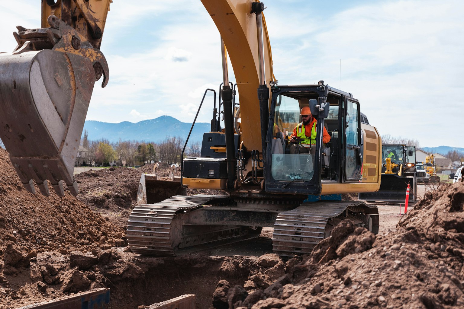 Bulldozer moving fill across an earthworks site